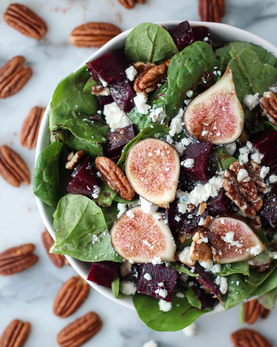 A white bowl filled with a fresh salad layered with dark green spinach and mixed leafy greens at the bottom, topped with deep purple cubed beets scattered throughout. Halved figs with light pink and cream centers and small white seeds are placed on top as a highlight. Brown pecan halves are spread evenly across layers, adding texture, and white crumbled cheese sprinkles are scattered on every part, creating contrast. The bowl sits on a white marbled surface with pecans and cheese pieces scattered around it. photo taken with an iphone --ar 4:5 --v 7