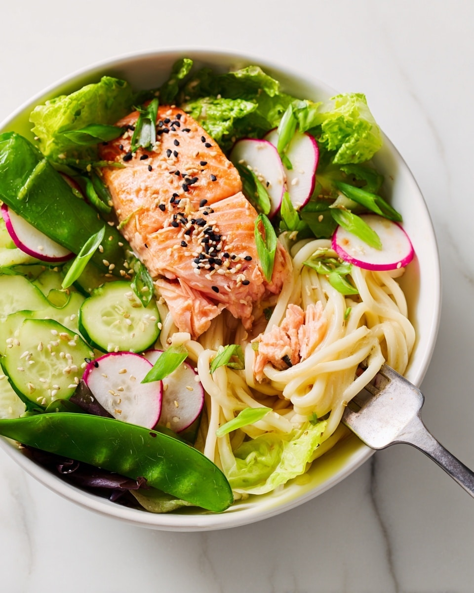 A white bowl filled with three layers: the bottom layer has fresh green and purple leafy lettuce around the edges; the middle layer contains white noodle strands mixed with thin slices of radish, cucumber, and scallion rings; the top layer features a piece of cooked salmon topped with black and white sesame seeds placed slightly off center, with a smaller salmon piece broken off to the side being held by a fork that also holds a few noodles. The bowl is on a white marbled surface. photo taken with an iphone --ar 4:5 --v 7