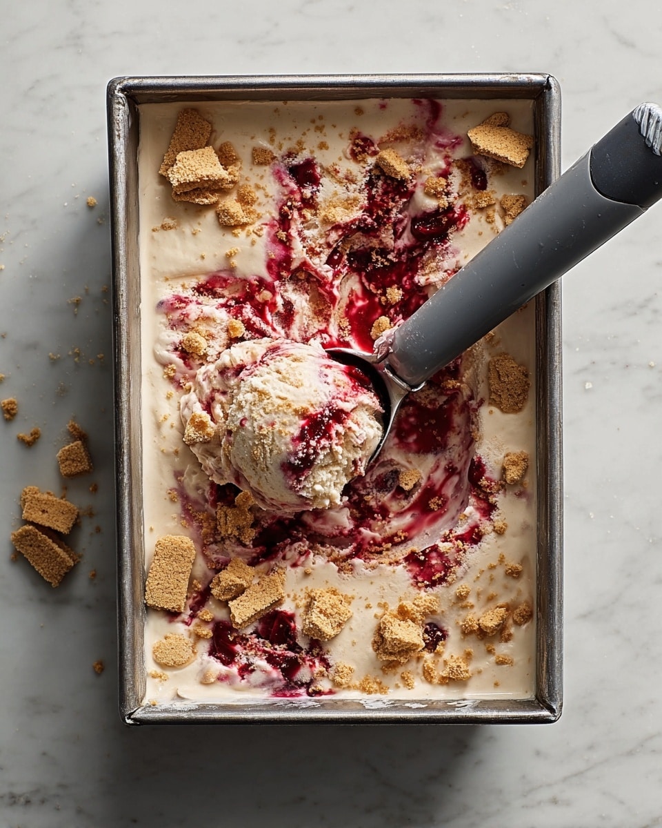 Three scoops of creamy white ice cream with swirls of pink-red berry sauce are placed closely together in a white bowl. The ice cream has small pieces of light brown cookie crumbles scattered on top and mixed into the ice cream itself, adding texture. A gold spoon is laid inside the bowl on the right side, partially covered by melting ice cream and berry sauce. The bowl sits on a white marbled surface. photo taken with an iphone --ar 4:5 --v 7