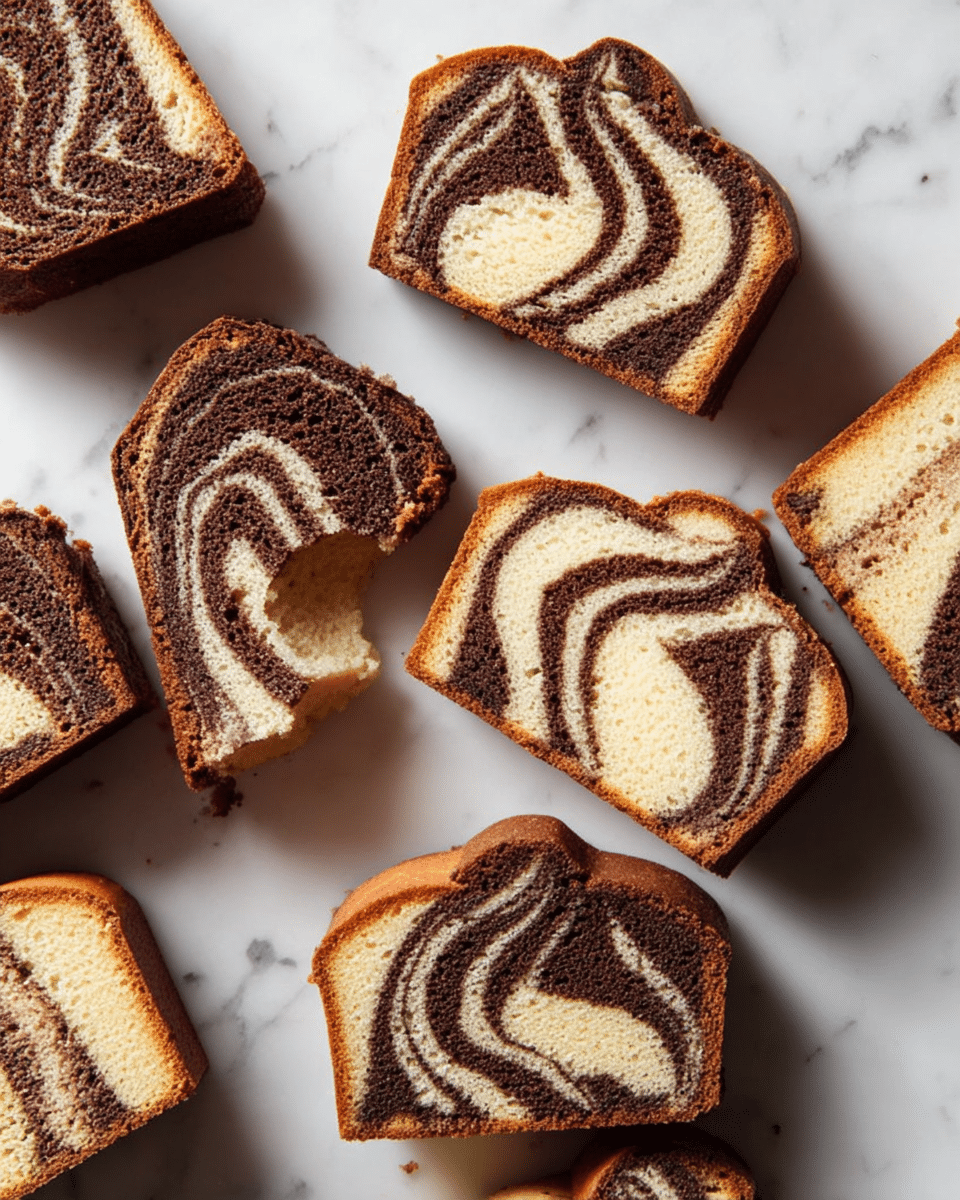 Several slices of marble cake are scattered on a white marbled surface. Each slice shows a swirl pattern of light cream and dark brown layers twisted together, creating a marbled effect. The texture looks soft and spongy, with some edges slightly crumbly. One slice has a small bite taken out of it, revealing the moist inside more clearly. The slices vary slightly in shape but all keep the curved form of the original cake. photo taken with an iphone --ar 4:5 --v 7