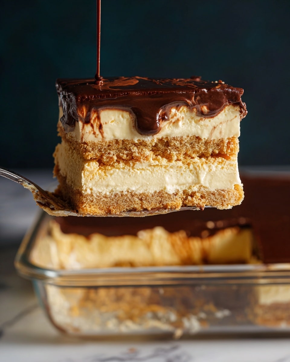 A close-up of a slice of layered dessert held by a utensil against a dark background. The slice has three main layers: two golden-brown crust layers, one at the bottom and one in the middle, both with a crumbly texture, and two thick creamy beige layers of filling between and above the crusts. The top is covered with a smooth, dark chocolate glaze that shines slightly. Below the slice, part of a transparent dish with more of the dessert inside is visible on a white marbled surface. photo taken with an iphone --ar 4:5 --v 7