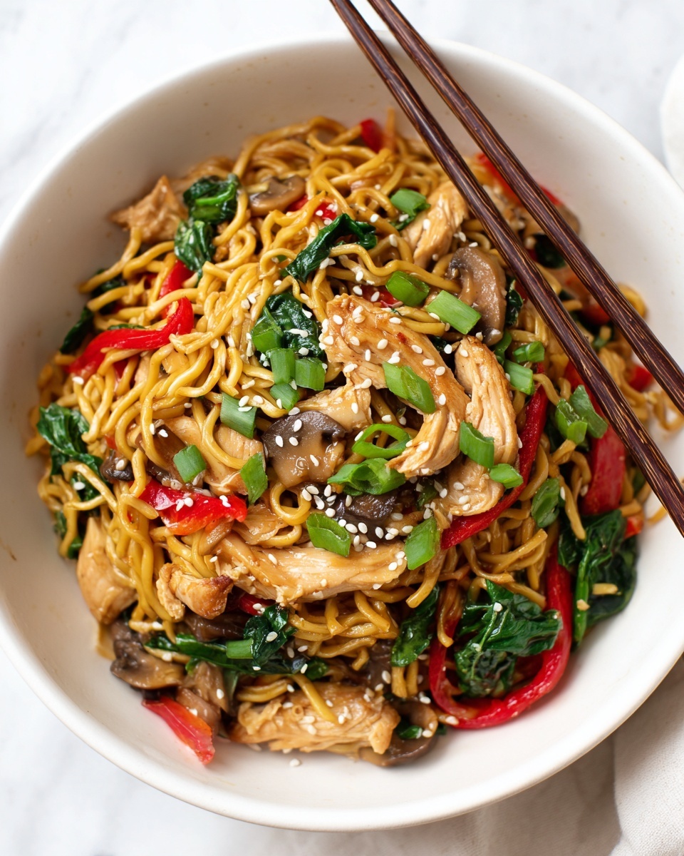 A white bowl filled with stir-fried noodles, layered with thin slices of cooked chicken scattered on top, along with green leafy vegetables at the bottom right side. Red bell pepper strips and small pieces of mushrooms are mixed throughout the noodles. The dish is garnished with chopped green onions and sprinkled with white sesame seeds. Two brown chopsticks rest on the top edge of the bowl. The background is a white marbled texture. photo taken with an iphone --ar 4:5 --v 7