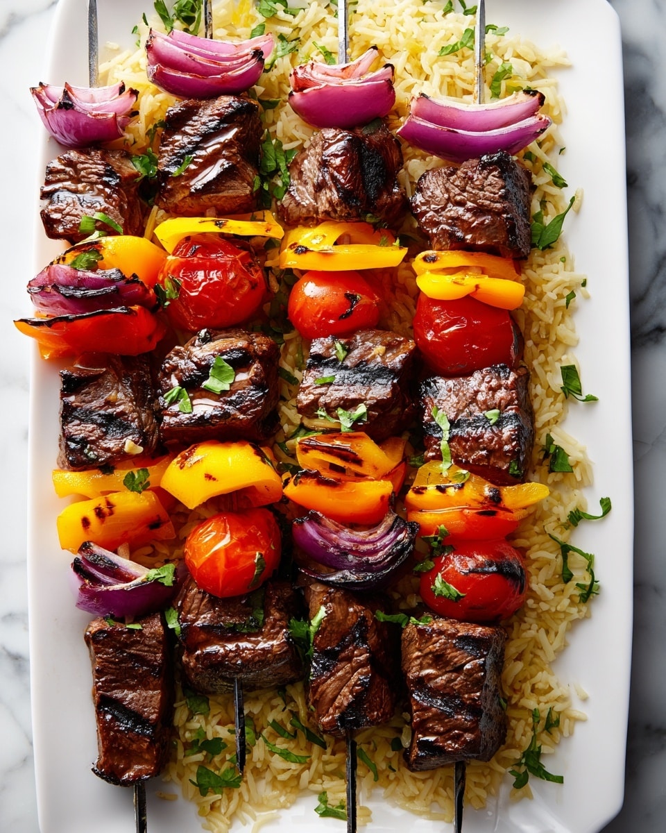 The image shows five skewers of grilled beef and vegetables arranged neatly on a white rectangular plate. Each skewer has four layers of dark brown grilled beef chunks with visible grill marks, alternating with bright layers of orange and yellow bell pepper pieces, deep purple slices of red onion, and glossy red cherry tomatoes. The skewers rest on a bed of golden-brown rice mixed with fresh green herbs, spread evenly across the plate. The white marbled surface is visible around the plate edges, enhancing the vibrant colors of the food. photo taken with an iphone --ar 4:5 --v 7