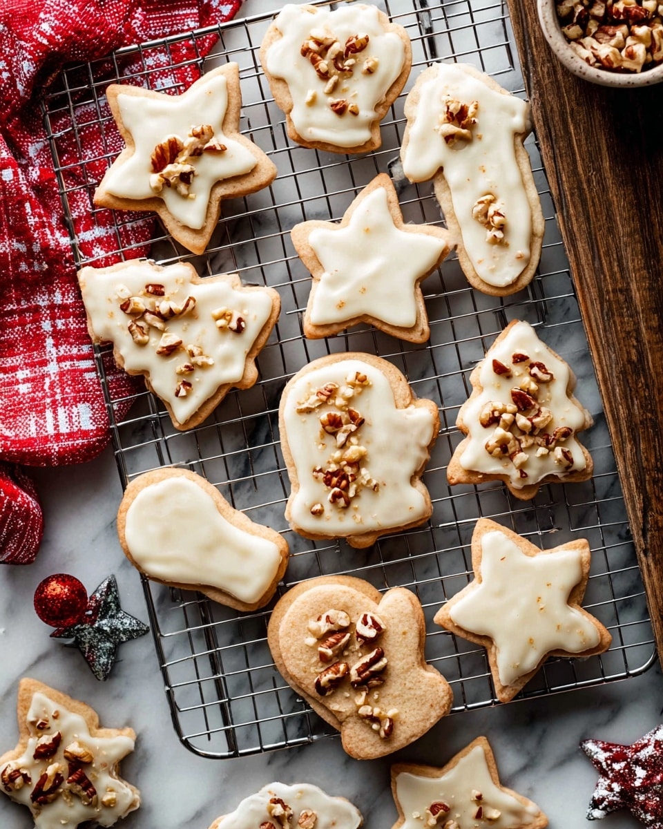 The image shows a group of freshly baked cookies on a silver cooling rack placed over a white marbled surface. There are different shapes like stars, Christmas trees, mittens, and bells. Each cookie has a light tan base with a layer of creamy white icing spread unevenly on top. The icing is decorated with chopped nuts, adding a crunchy texture and brown color contrast. Some cookies are whole, while others are broken into pieces, showing their soft inside. The scene also includes small festive decorations and a red and white cloth partly visible on the side. photo taken with an iphone --ar 4:5 --v 7