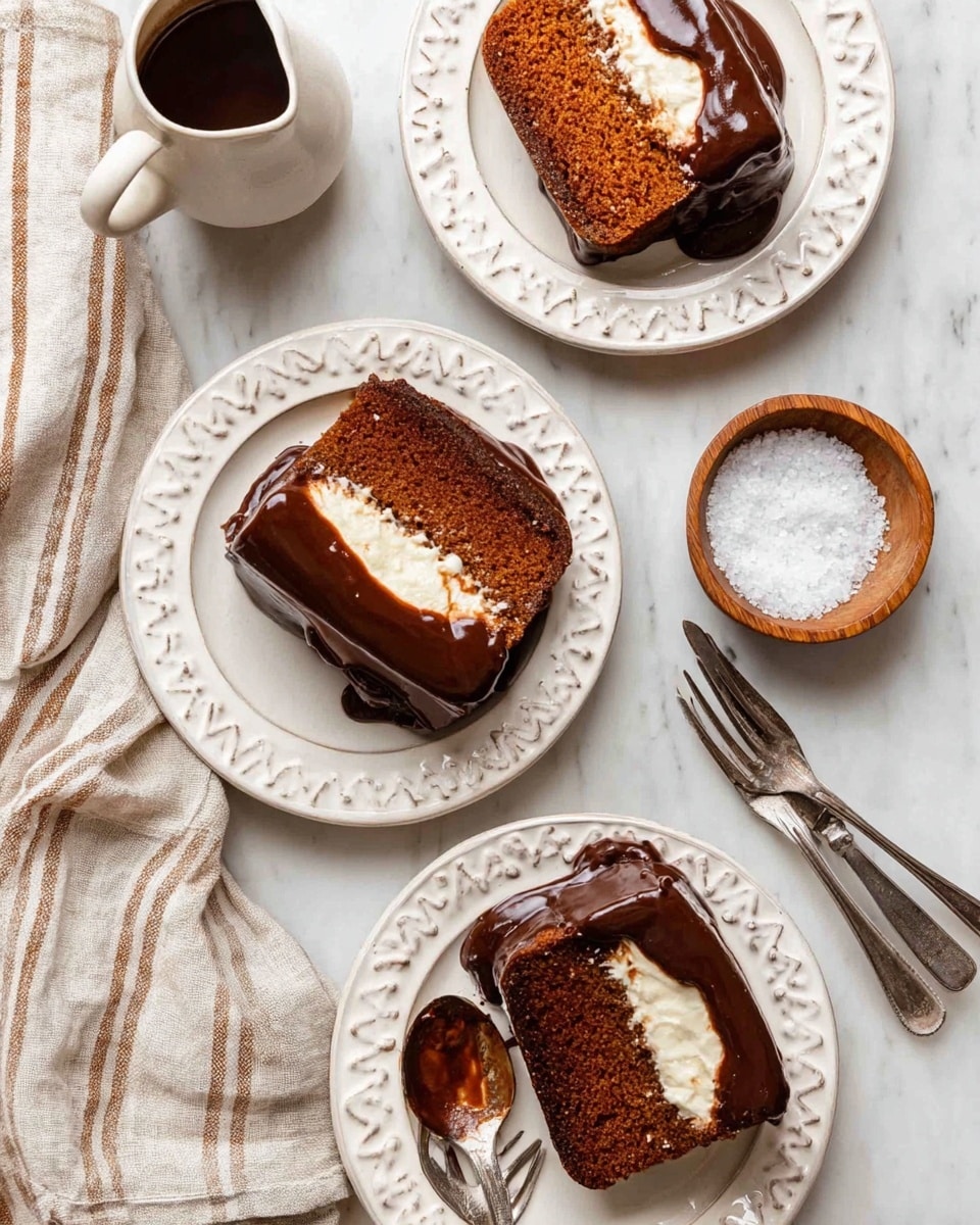 Three slices of moist brown cake with a creamy white layer in the middle are placed on three white decorative plates. Each cake slice is topped with a thick layer of shiny dark brown chocolate glaze that drips slightly over the sides. The plates sit on a white marbled surface. Near the top left, there is a small white jug filled with chocolate sauce, next to it a small wooden bowl holds coarse white salt. Two silver forks lay side by side near the bottom left, and a beige linen cloth with stripes is folded nearby. One fork is placed on the bottom plate, resting on the cake slice. The scene is bright and inviting. photo taken with an iphone --ar 4:5 --v 7