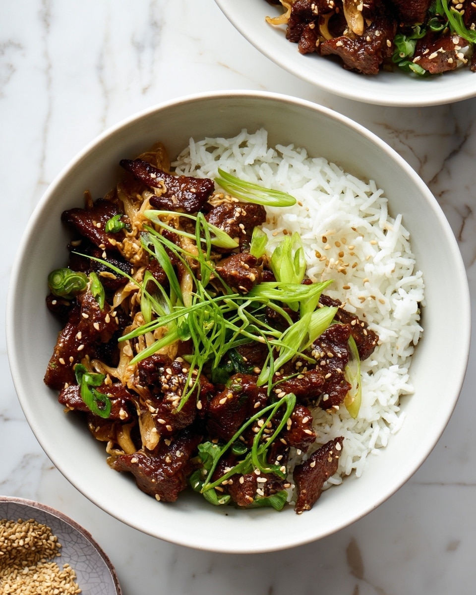 A close-up of a bowl with two main layers: the bottom layer is fluffy white rice filling about half the bowl with a soft texture, and the top layer is a rich, dark brown stir-fry with glossy pieces of cooked beef mixed with light brown, thinly sliced cabbage and small sesame seeds scattered on top. Bright green thinly sliced scallions lay over the stir-fry as a fresh garnish. The dish is served in a smooth white bowl placed on a white marbled surface, with part of another white bowl of the same dish visible at the top right corner and a small bowl with sesame seeds below it. photo taken with an iphone --ar 4:5 --v 7